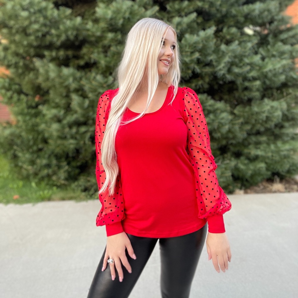 Red long sleeve with black dots